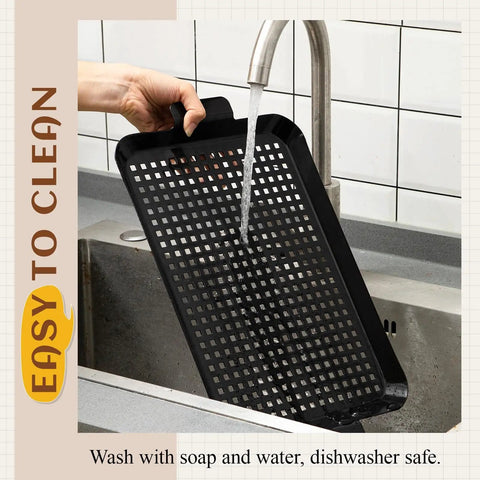 Heavy Duty Stainless Steel Grill Tray Set 3 Pack Nonstick Perforated Grill Baskets With Handles being washed under tap