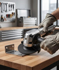 Hulking Five Inch Pneumatic Angle Grinder Dropping 11000 Rpm of Wild Air Power cutting metal bracket on workbench with gloves.
