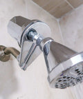 Chrome inline shower filter with easy replace cartridge cuts chlorine by up to 98 percent, attached between shower arm and head.