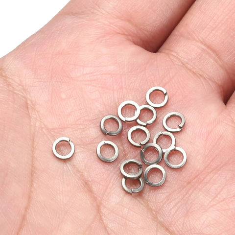 100 Pack 1/8 Inch Spring Lock Washers Made From Solid 316 Stainless Steel Split Helical Elastic Gasket in hand.
