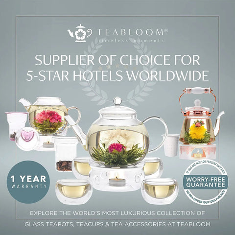 Display of Teabloom glass teapots with blooming teas and cups, highlighting warranty and 5-star hotel supplier status.