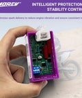 Close-up of 5 Pin AC CDI Ignition Module Replacement for ATV Dirt Bike Scooter Go Kart with DIP switch visible in hand