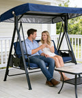 Couple relaxing on heavy duty waterproof 3 seat swing with navy canopy for porch garden backyard bench swing in outdoor setting.