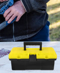Rock Solid Plastic Toolbox Organizer With Heavy Duty Carry Handle And Secure Snap Buckle Closure For Mechanics Workshop hardware tool storage on a work table.
