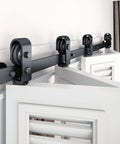 Heavy Duty Bifold Sliding Barn Door Hardware Track Kit With Hassle Free Mount And Silky Smooth Glide, Sweet Solution For Cramped Spaces, Black supports four doors and features sturdy steel rollers.