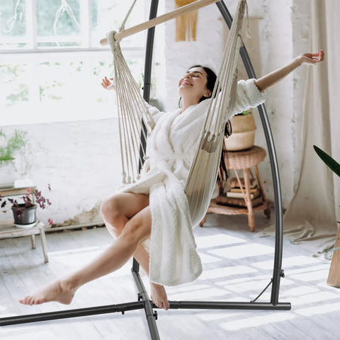 Heavy Duty Hammock Swing Stand With Solid Steel Construction, Easy Ten Minute Assembly, includes person enjoying swing