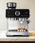 One Touch Auto Grind Espresso Machine With Smart Dosing And Brushed Stainless Steel Finish brewing espresso into glasses on countertop.