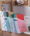 Slick 12 Quart Clear Storage Bins With Built In Carry Handles Narrow Rectangular Organizer Containers For Pantry Closet Cabinet Shelf And Home Organization Straight Up Durable Two Pack holding notebooks and supplies.