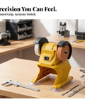Kickass Compact Bench Grinder Featuring Dual Wheel Sharpening And Polishing Rig With Rugged Suction Base on workbench.
