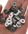 Hand holding washers from Heavy Duty 304 Stainless Steel Carriage Bolt Nut And Washer Assortment Kit For Secure Connections