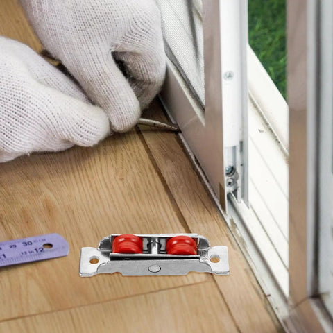 Rugged Sliding Door Pulley Track Set With Silent Dual Wheel Rollers And Rigged Tight Stainless Steel Nylon Bearings installation near wooden floor.