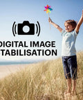A Real Deal 16 Megapixel Digital Camera With 5X Optical Zoom That Knocks Out Crisp Pictures Plus 28mm Wide Angle Lens And 1080P Full HD Video Recording For Travel Vibes And Family Moments So You Can Vlog Life Updates Without Breaking The Bank with digital image stabilisation feature in action, showing a happy child in a grassy field.
