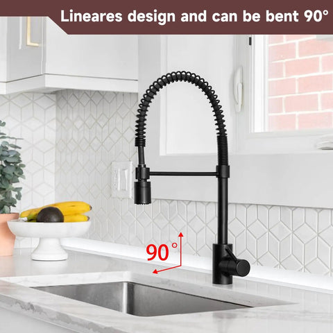 Modern kitchen faucet with black flexible hose, bent 90 degrees, above a stainless steel sink against a white tile backsplash.