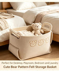 Hardcore Foldable Felt Storage Basket With Dual Handles Slick Collapsible Fabric Bin Organizer For Shelves Closet Laundry Keeps Your Crib Lookin Fresh Hassle Free Game Changer For Toys Nursery Bedroom Office In Brown with teddy bear and blankets.