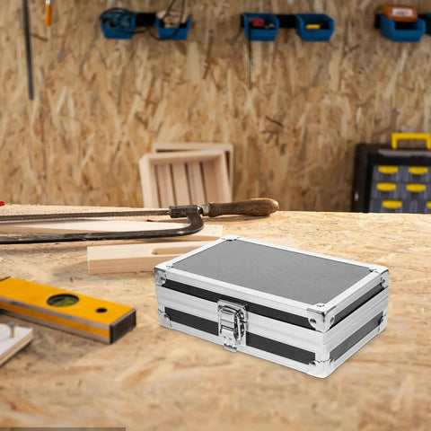 Rugged As Nails Portable Aluminum Tool Box With Secure Locking Lid on a workbench, durable black finish and sturdy latches.