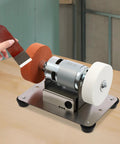 No Nonsense Mini Bench Grinder Rockin A Beefy 96W Copper Motor With Seven Smooth Variable Speeds From 3000 To 6000 Rpm Plus Easy Forward Reverse Controls For Quick Sharpening And Precision Grinding Work, showing tool sharpening in use.