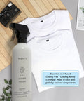 The Ultimate 3 In 1 Wrinkle Release Spray That Kicks Static Cling And Cuts Odor For Crisp Clothes Without Ironing In A Legit Plant Derived Quick Fix 3 Oz Travel Bottle With No Sweat Fabric Refresher Power next to two white t-shirts.