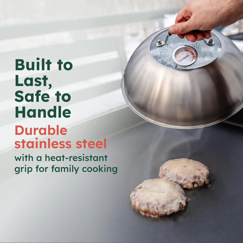 Hand using 12 Inch Stainless Cheese Melt Dome With Glass Lid And Built In Thermometer Up To 700 F Steam Vent For Faster Melts On Burgers And Veggies The Go To For Flat Top Griddles BBQ And Hibachi Grills over burgers.
