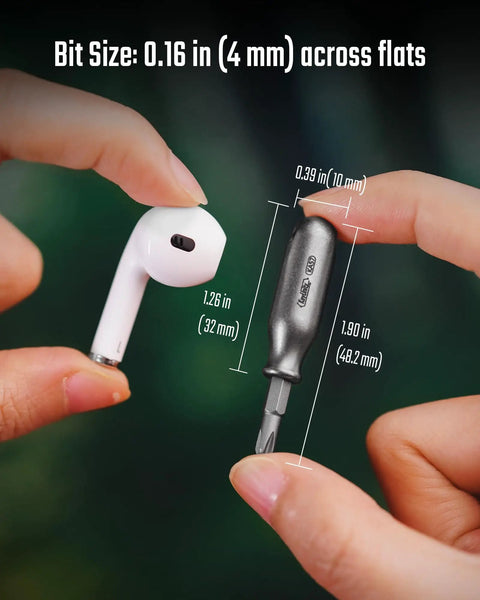 Rock Solid Premium Titanium Mini Screwdriver Featuring Super Magnetic Replaceable Bits And Rapid Philips Flathead Swaps For Trustworthy Daily Use Everywhere next to earbud, showing size comparison.
