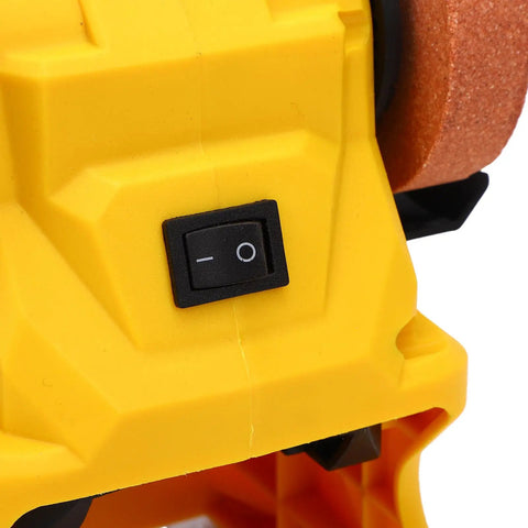 Go Anywhere Cordless Mini Bench Grinder Powerhouse power switch on yellow chassis for easy operation during tool sharpening.