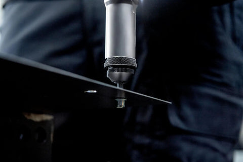 Top Shelf 18V Cordless Rivet Nut Gun With Hella Precision Adjustable Settings being used on metal sheet with a rivet.