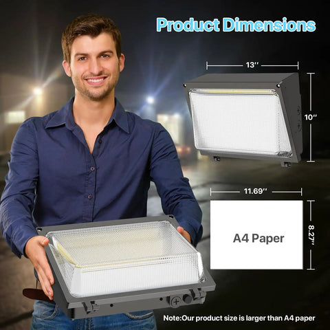 Man holding Built Tough 120W LED Wall Pack Light With Crisp Glass Lens And Auto Dusk To Dawn Sensor For Kickass Outdoor Security And Yard Patio Flood Lighting UL Listed next to dimensions.