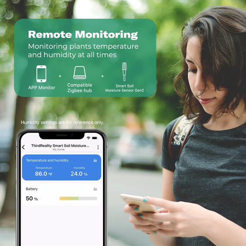 Woman checking Gen2 Smart Soil Moisture Sensor data on smartphone app, showcasing remote monitoring with Zigbee hub integration.