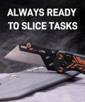 Heavy Duty Folding Utility Knife With Slick Blade Swap Mechanism And Grippy G10 Handle Includes Nine Backup Razor Blades For Snappy Cuts On Tough Workdays Or DIY Weekender Projects Smooth As Silk on gray fabric background.