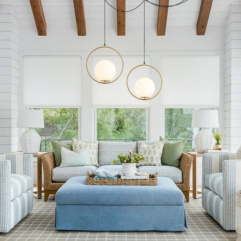 Living room with Large White Glass Globe Pendant Light With Plug In Cord Brushed Gold Ring Mid Century Modern Style.