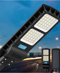 Outdoor Solar Street Light IP67 Waterproof 600 LEDs 30000 Lumens shown with remote and solar panel against road backdrop