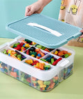 Slick 3 Tier Stackable Brick Storage Organizer With Removable Grid Trays For Lego Pieces, open with colorful bricks inside.