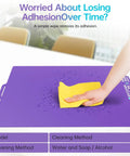 Person cleaning a purple Glacier Cold Build Plate For Bambu Lab 3D Printers with a yellow cloth.