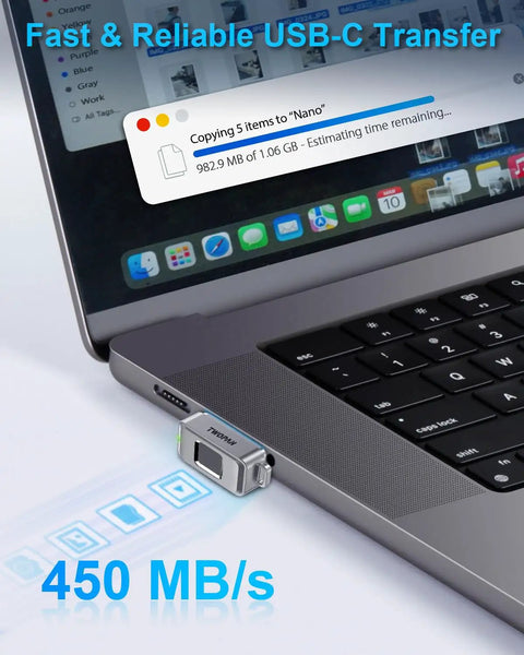 Fingerprint Nano SSD 512GB External Solid State Drive Up To Four Hundred Fifty Megabytes Per Second Pocket Sized Keychain Portable Backup For iPhone iPad MacBook Steam Deck PS5 And More showing data transfer to a MacBook at 450 MB/s.