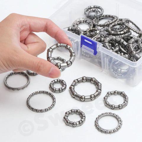 Top Shelf Bicycle Ball Bearing Repair Kit Includes Fifty Precision Steel Roller Bearings In Ten Essential Sizes displayed in a plastic case.