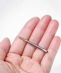 Four Pack M2x0.4mm Metric Thread Taps With Titanium Coated HSS Steel 44mm Straight Flute shown in hand for CNC applications