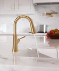 hansgrohe Joleena Pull Down Kitchen Faucet, Transitional, Magnetic Hand Sprayer, 1-Handle, 1.75 GPM, Brushed Bronze, 04112140 pouring water in sink