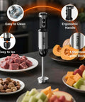 Badass Heavy Duty Immersion Blender With 20 Speed And Turbo Boost Copper Motor Handheld Kitchen Mixer Stainless Steel Blades Milk Frother Whisk Mini Chopper Real Game Changer For Creamy Smoothies And Soups Black with ergonomic handle and stainless steel body, surrounded by chopped meat and fruits.