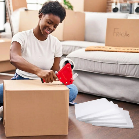 Heavy Duty White Foam Board Panels For Tight Parcel Wrapping And Rock Solid Packing Supplies That Keep Your Fragile Merchandise Locked Safe Through Shipping, woman packing box with foam panels nearby.