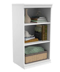 Versatile Modular Storage Shelf With Three Adjustable Shelves Stackable Closet Organizer showcasing white laminate finish and filled with books and decor.