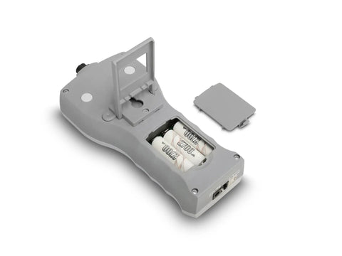 Heavy Duty Digital Force Gauge Built Tough For Tension And Compression Work with battery compartment open, gray exterior.