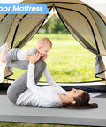 Mother and child on 3 Inch Memory Foam Camping Pad For Car Camping And Tents, Cushy Roll-Up Floor Mat in a tent