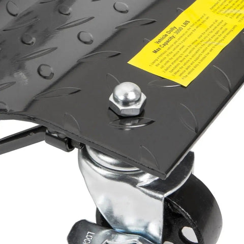 Close-up of Four Pack Premium Badass Wheel Dollies For Moving Your Rig Rated At 6000 Lbs Capacity showing black steel surface and swivel caster.