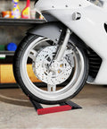 Heavy Duty Motorcycle Wheel Roll Back Stand Aluminum Portable Tire Service Center For Quick Chain Lube Driveline Tune Ups Non Slip Garage Base supports motorcycle wheel on garage floor.