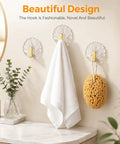 10 Pack Invisible Adhesive Wall Hooks With Chic Gold Shell Design Waterproof Heavy Duty Strong Hold For Bathroom Shower Kitchen Organization Easy Install with towel and sponge.