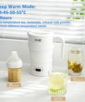 Foldable Electric Kettle 700ml Portable Collapsible Water Boiler With Keep Warm And Delay Start BPA Free 600W 304 Stainless Steel White next to glasses of beverages.