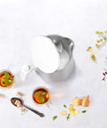 Top view of Cool Touch 1 Liter Cordless Electric Kettle With Double Wall Stainless Steel and tea cups on a light surface