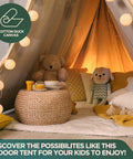 Indoor tent setup with Rugged Cotton Duck Drop Cloth For Painting And Protection, pillows, and string lights for children's play.