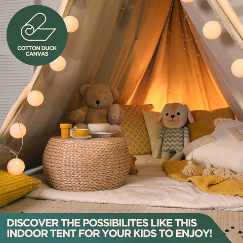 Indoor tent setup with Rugged Cotton Duck Drop Cloth For Painting And Protection, pillows, and string lights for children's play.
