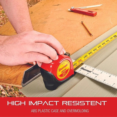 Person measuring wood with retractable metric pocket tape measure, featuring self-adjusting end hook, on a workbench.