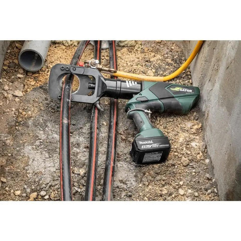 Heavy Duty Gator Remote Cable Cutter Bare Tool With Wireless Remote for snipping soft metal jackets resting on ground near cables.